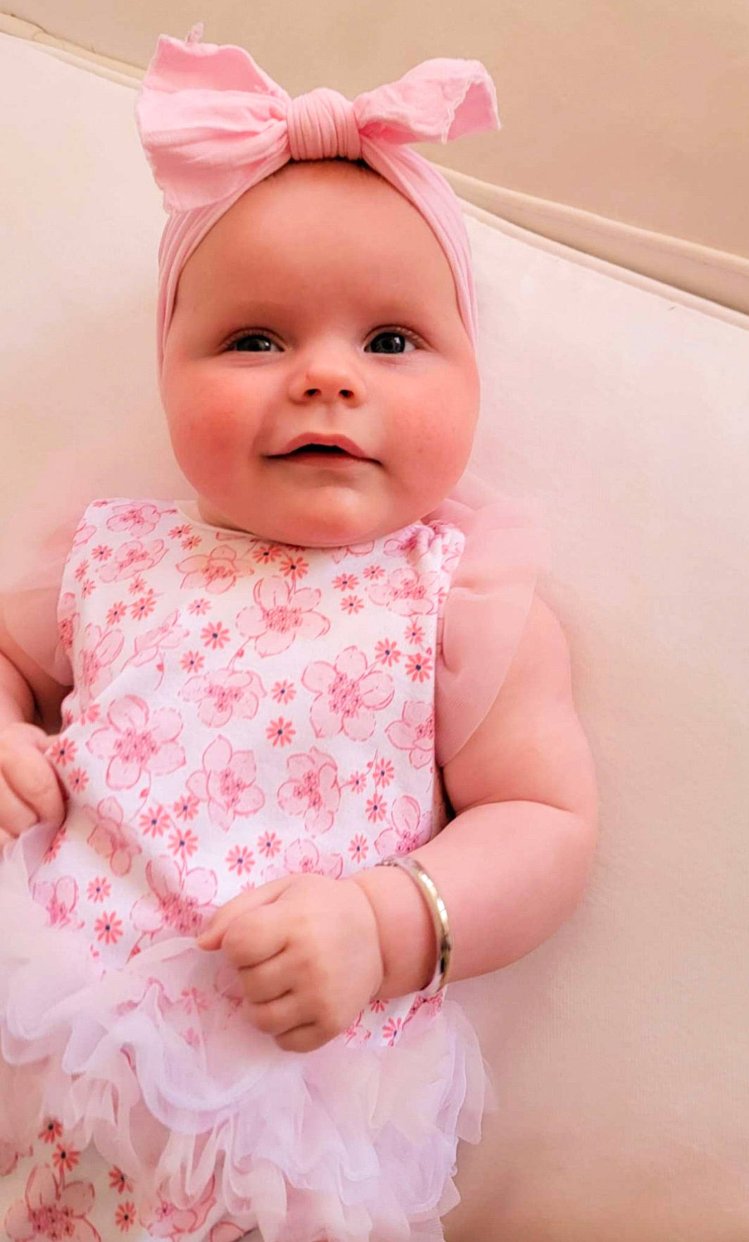 Vivian is registered to the contest to win money with this photo: baby, baby_toddler_clothing, cap, cheek, child, costume_hat, dress, face, happy, headgear, headwear, magenta, outerwear, peach, person, pink, skin, sleeve, smile, textile