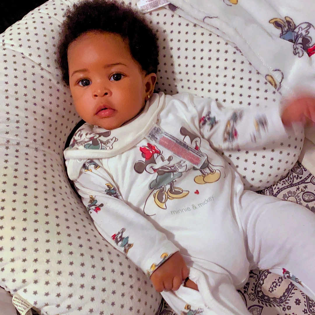 Nnenna joined the competition — help win amazing prizes! baby, bed, bedroom, blanket, bodypart, couch, crib, cushion, face, finger, furniture, hand, head, homedecor, indoors, infantbed, person, photography, portrait, room