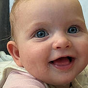 Tahlia is registered to the contest to win money with this photo: baby, child, face, smile, blue_eyes, closeup, infant, happy, skin, cheeks, mouth, tongue, clothing, person, cute, expression, young_child, indoors, portrait, head