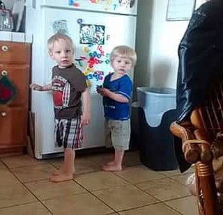 Emmanuelabraham is registered to the contest to win money with this photo: baby, blurred, cabinetry, child, event, floor, flooring, fun, hardwood, joint, person, picture_frame, play, room, shorts, shoulder, sleeve, t_shirt, thigh, toddler