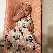 Luna joined the competition — help win amazing prizes! baby, child, girl, dress, headband, flower, mickey_mouse, pattern, pink, cushion, hand, face, indoor, wall, sock, cute, portrait, infant, smiling, resting