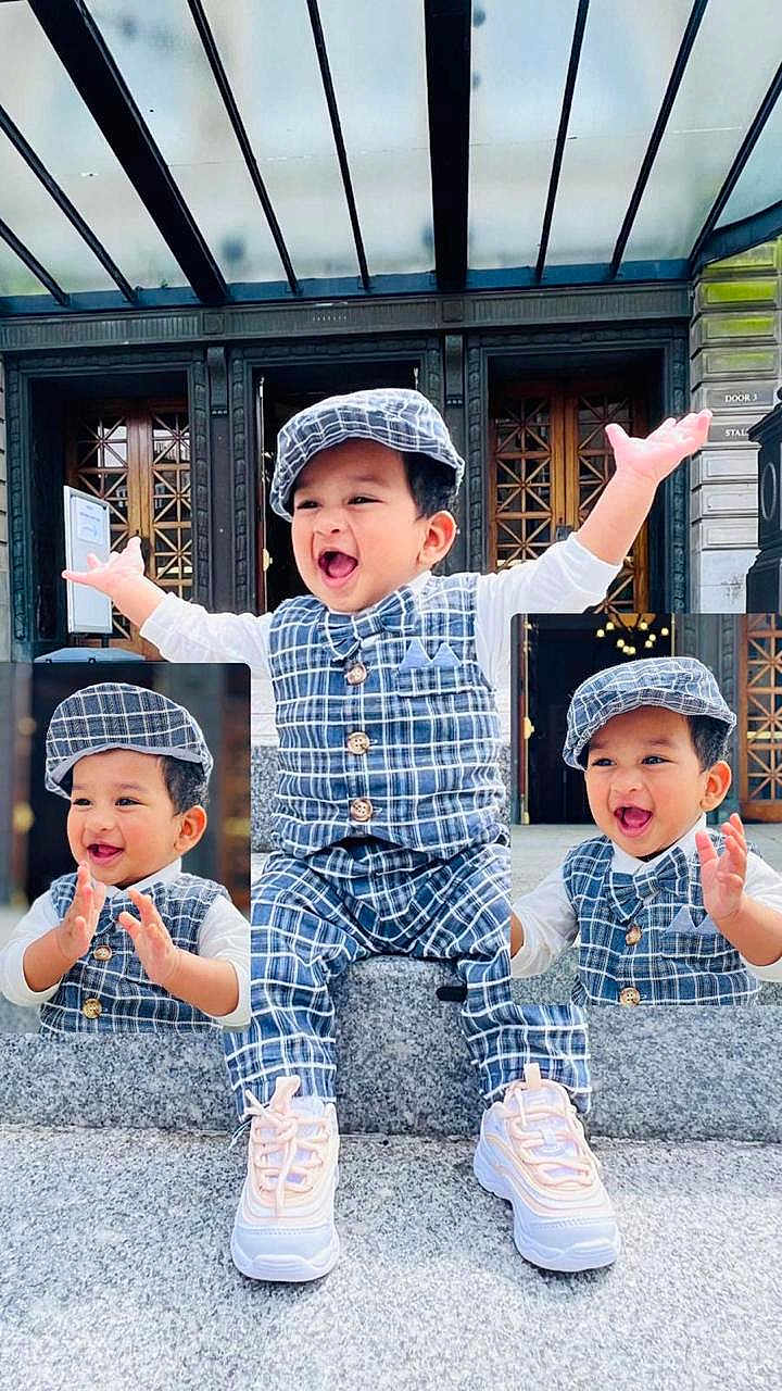 Diyan joined the competition — help win amazing prizes! toddler, child, smiling, clapping, plaid_outfit, cap, sneakers, stone_ledge, outdoor, glass_roof, wooden_doors, happy, person, portrait, fashion, cute, playful, young_child, multiple_poses, daylight
