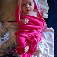 Shiloh joined the competition — help win amazing prizes! baby, blanket, bonnet, clothing, couch, doll, face, hat, head, hood, hoodie, knitwear, newborn, person, photography, portrait, sweater, sweatshirt, towel, toy
