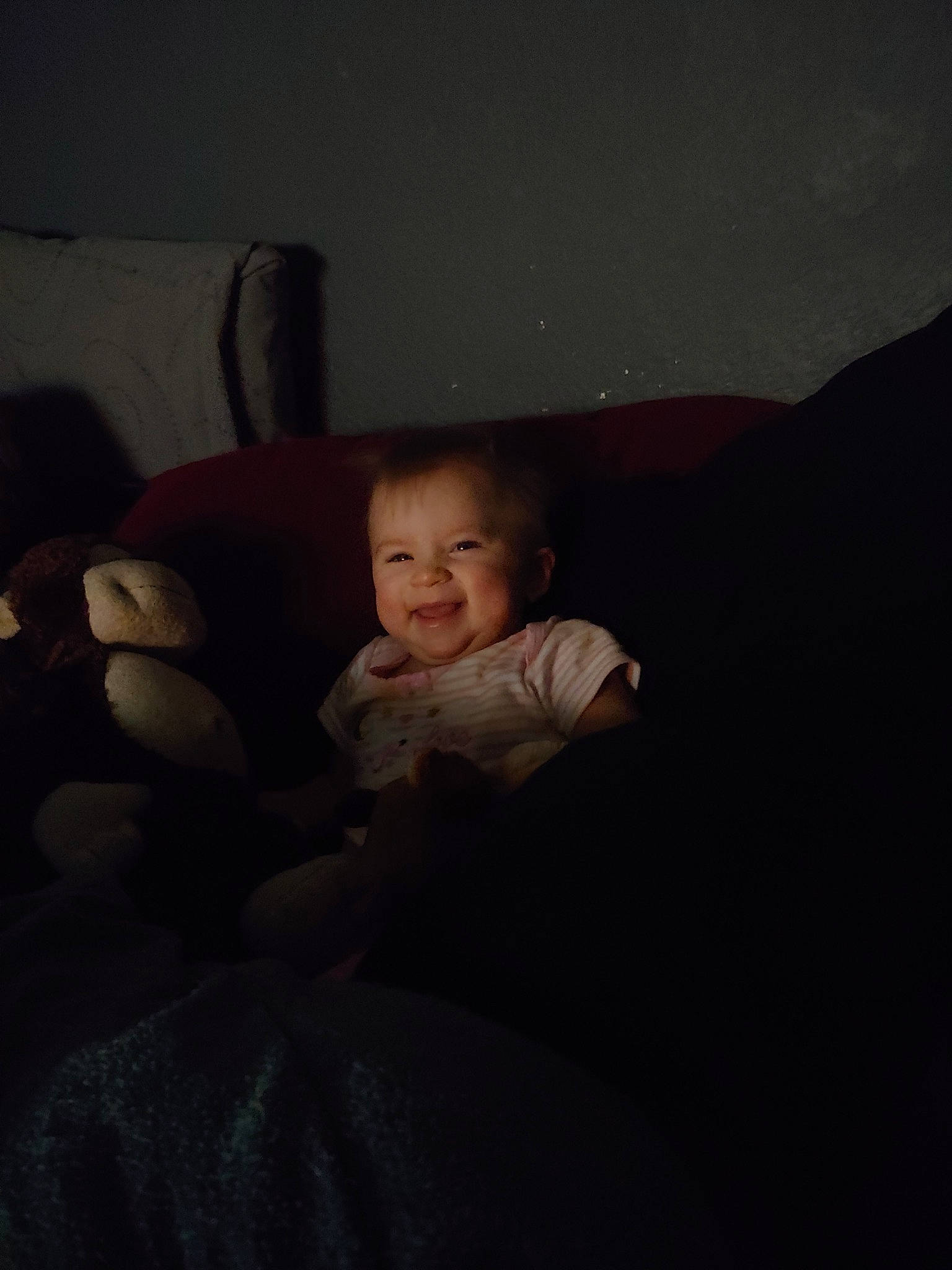 Harley Quinn is registered to the contest to win money with this photo: baby, bed, cheek, child, cloud, darkness, eye, face, fun, furniture, head, night, person, room, sitting, skin, sky, toddler, vacation