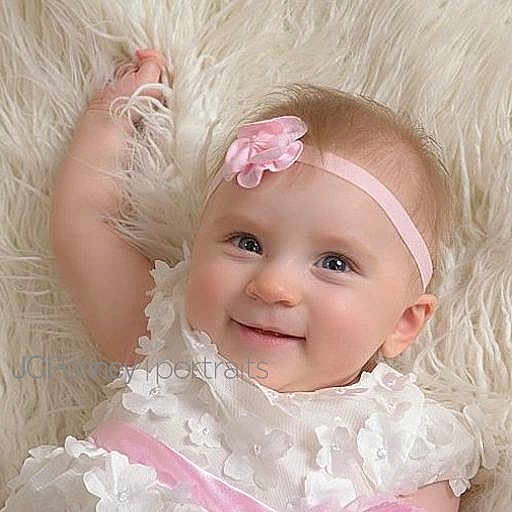 Harley Quinn is registered to the contest to win money with this photo: baby, beauty, blond, cheek, child, close_up, eye, face, fur, hair, head, headgear, iris, lip, nose, person, pink, product, skin, smile