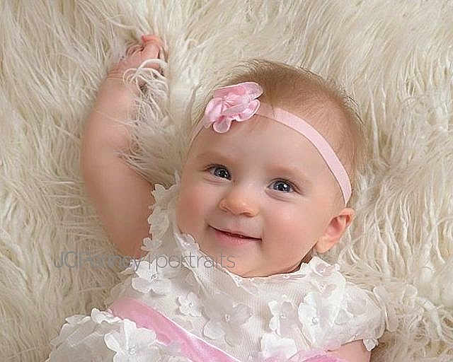 Harley Quinn is registered to the contest to win money with this photo: baby, beauty, blond, cheek, child, close_up, eye, face, fur, hair, head, headgear, iris, lip, nose, person, pink, product, skin, smile