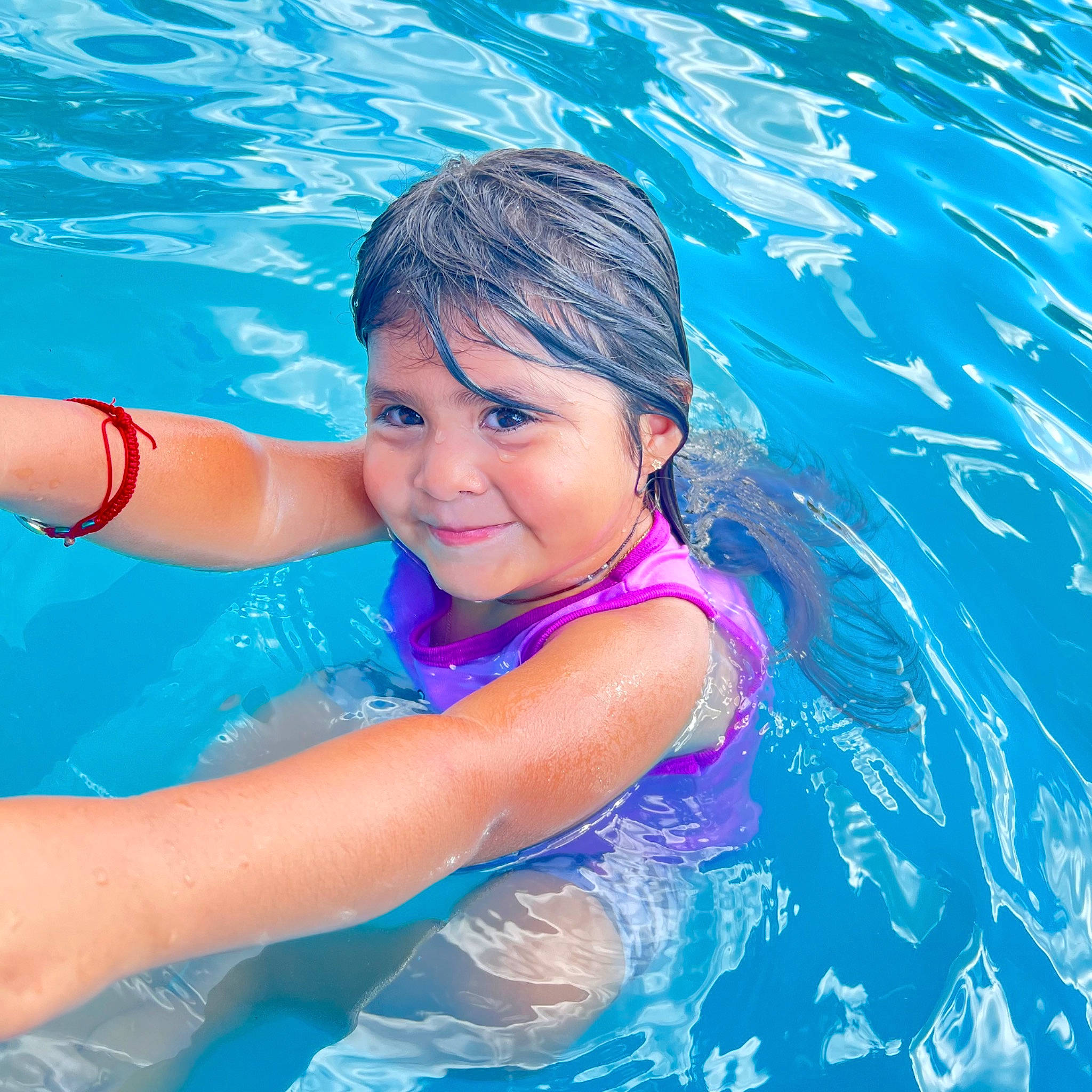 Lorena Luna is registered to the contest to win money with this photo: aqua, azure, black_hair, child, electric_blue, eye, facial_expression, fun, happy, headwear, joy, leisure, mammal, outdoor_recreation, people_in_nature, person, product, recreation, smile, swimming_pool