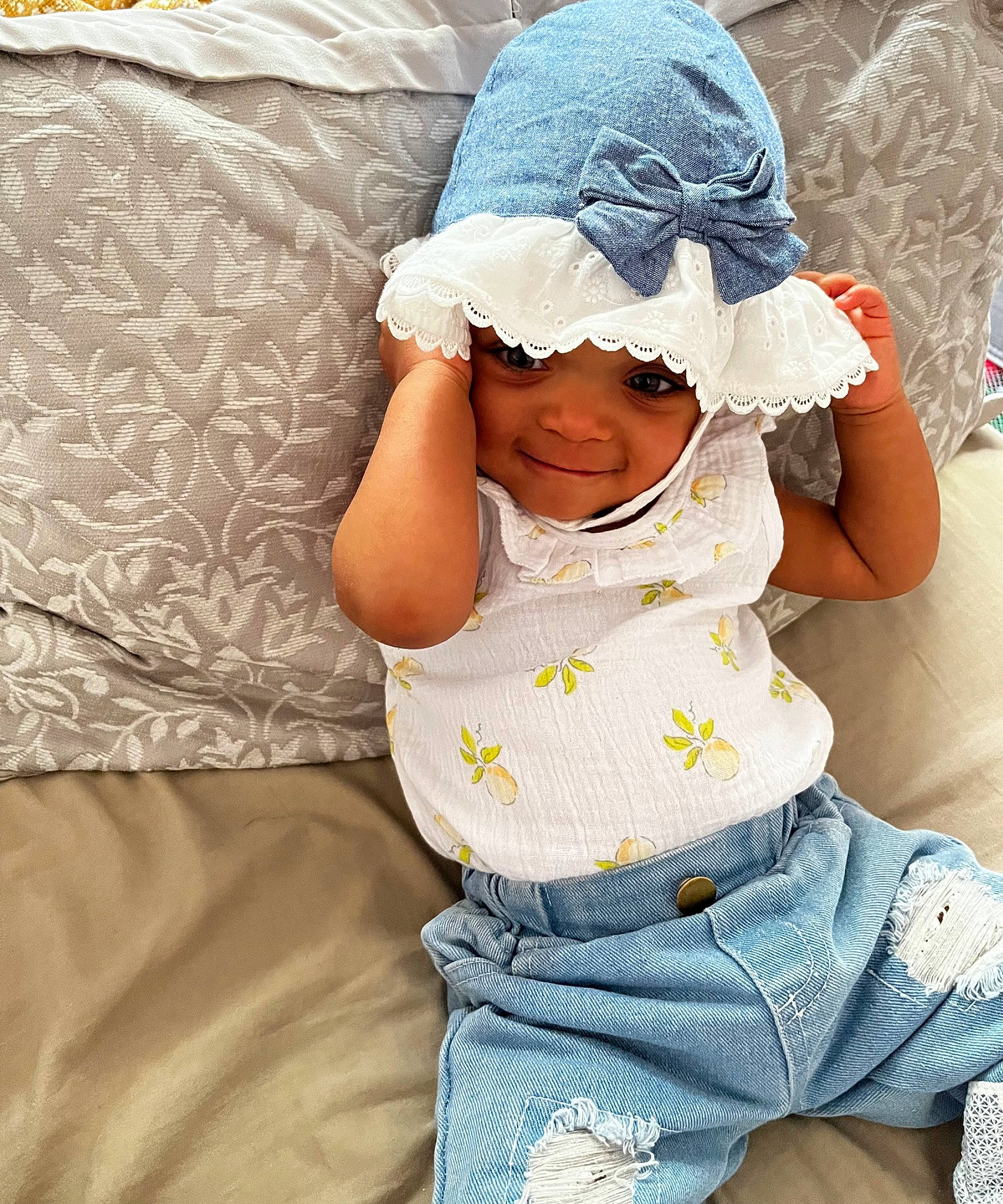 Ariana joined the competition — help win amazing prizes! baby, baby_toddler_clothing, cap, child, comfort, fashion_accessory, fun, happy, hat, headgear, headwear, joy, linens, pattern, person, play, sitting, skin, sleeve, smile