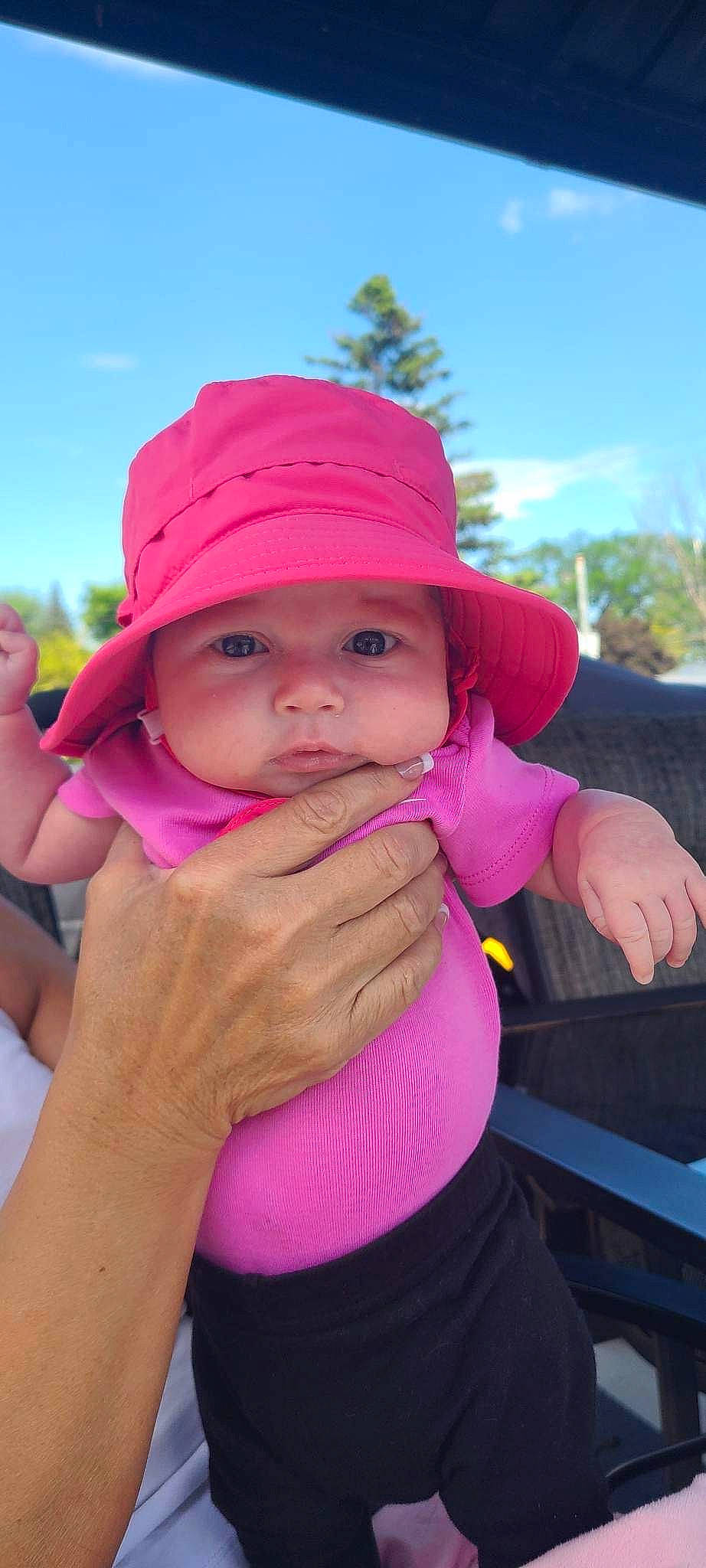 Aliyah a rejoint le concours — aidez-le/la à gagner de superbes lots ! arm, baby, cap, fun, gesture, hand, happy, hat, headgear, headwear, leisure, lip, magenta, person, pink, product, purple, skin, sky, sun_hat