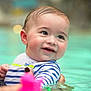 child, baby, smiling, swimming_pool, water, adult, parent, swimwear, stripes, portrait, closeup, adorable, wet_hair, holding, playful, mother, aquatic, innocence, joyful, face