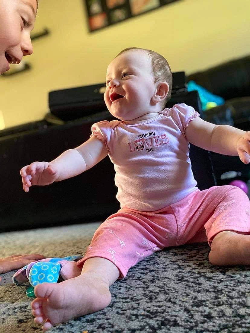 Rachel joined the competition — help win amazing prizes! baby, baby_toddler_clothing, cheek, finger, floor, flooring, fun, green, happy, head, joint, knee, leisure, person, pink, skin, sleeve, smile, standing, thigh