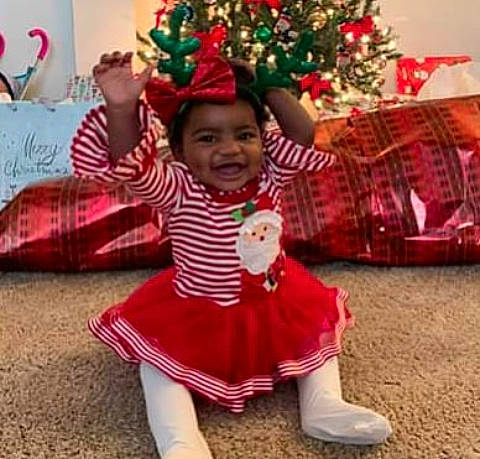 Marley joined the competition — help win amazing prizes! baby, child, child_model, christmas, christmas_decoration, christmas_eve, christmas_tree, costume, event, fictional_character, happy, holiday, person, plant, play, sleeve, smile, toddler, tradition