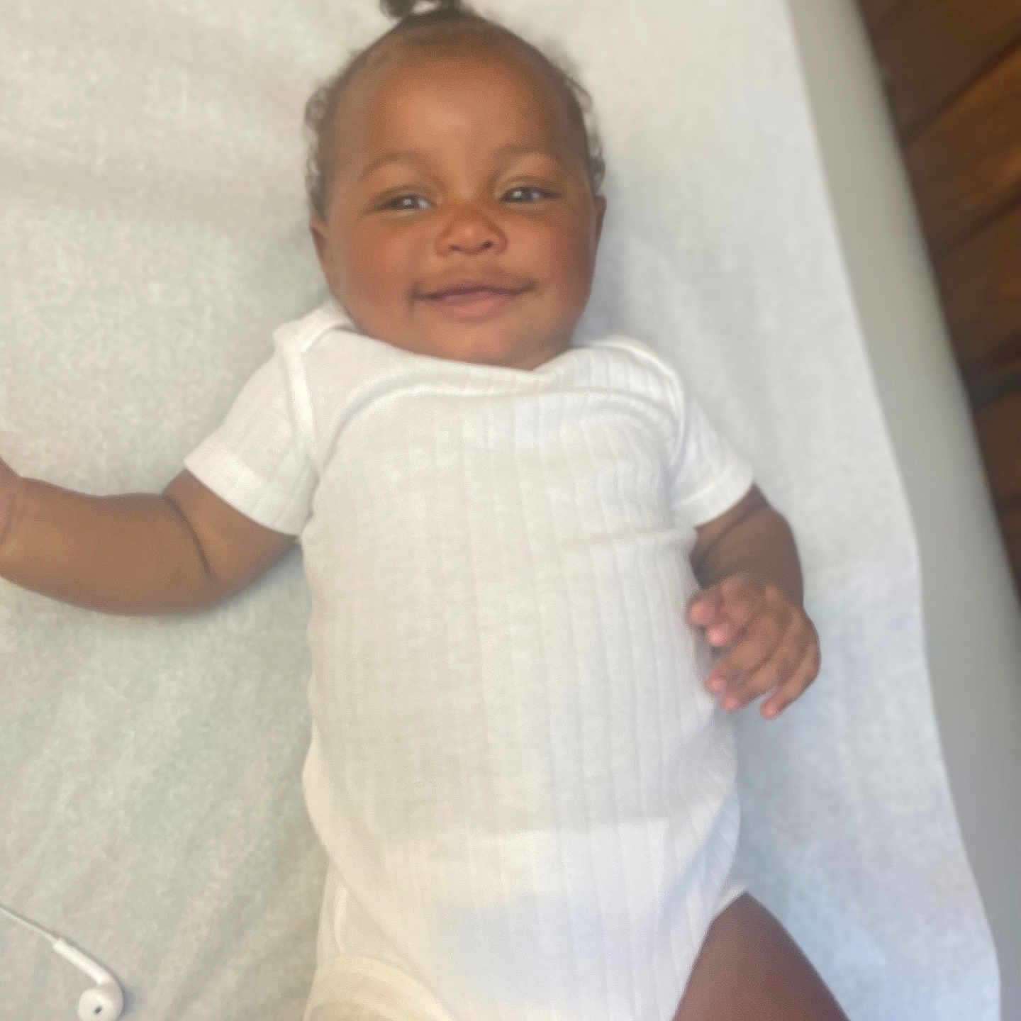 Faith is registered to the contest to win money with this photo: baby, babylaughing, bathing, bed, clothing, crib, cushion, face, furniture, happy, head, homedecor, infantbed, laughing, newborn, person, photography, portrait, smile, t_shirt