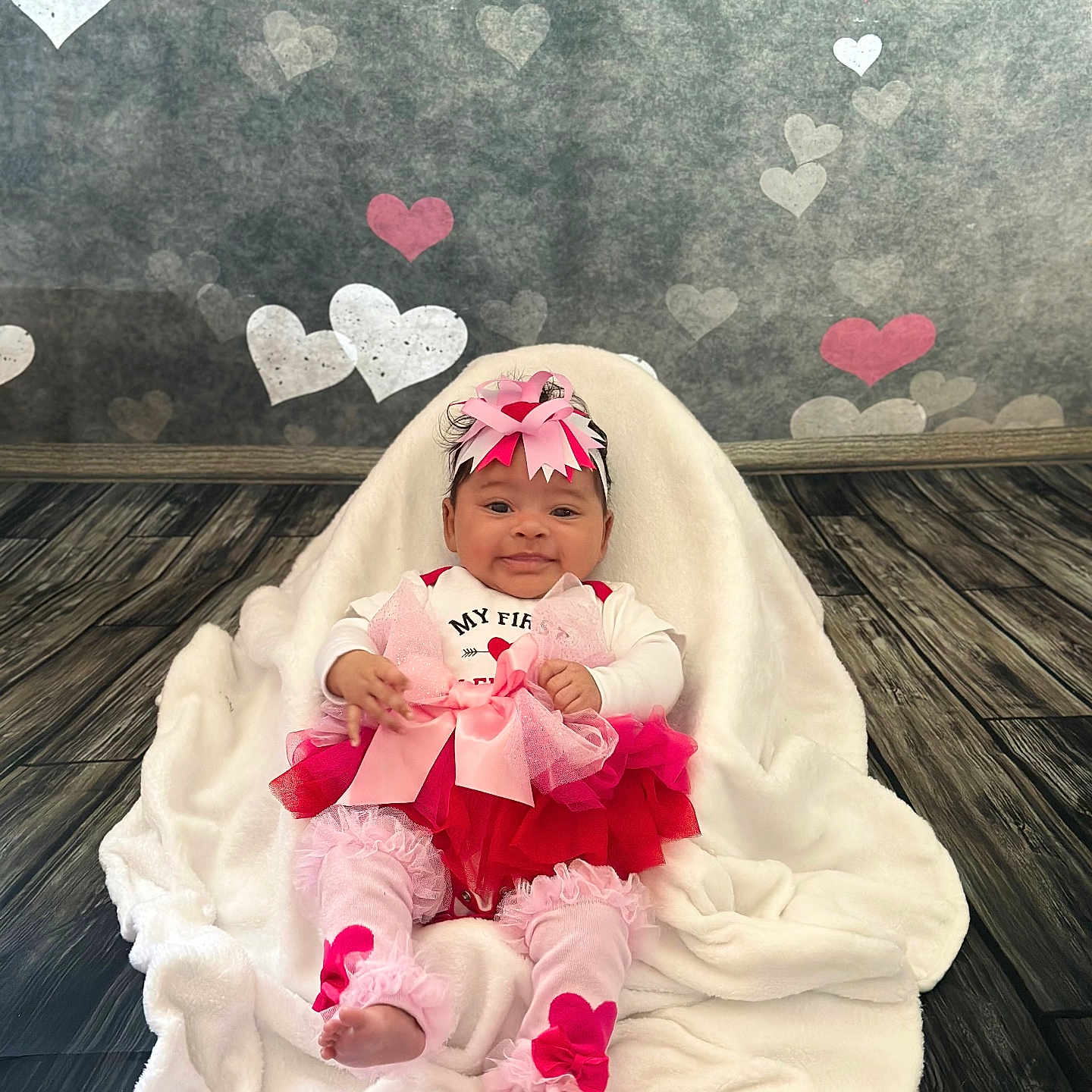 Onyx is registered to the contest to win money with this photo: baby, blanket, clothing, costume, dress, face, flower, furniture, happy, hat, head, newborn, person, petal, photography, plant, portrait, quilt, smile, towel