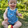 baby, child, outdoor, grass, apple, bite, blue_clothing, head_wrap, smiling, happy, sitting, nature, greenery, summer, infant, closeup, cute, foot, hand, playful