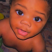 Zameer is registered to the contest to win money with this photo: adorable, baby, child, closeup, curly_hair, cute, expression, eyes, face, head, human, indoor, innocent, looking_up, person, portrait, skin, smile, soft_lighting, young