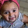 Naiomi is registered to the contest to win money with this photo: baby, child, face, tongue, headband, pink, bow, clothing, grey, cute, playful, portrait, closeup, smiling, happy, infant, person, indoors, skin, eyes