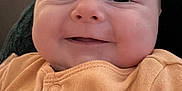 Rowan joined the competition — help win amazing prizes! baby, infant, smiling, face, orange_clothing, cute, indoors, portrait, child, happy, skin, head, eyes, mouth, buttoned_clothing, blanket, door, human, closeup, expression