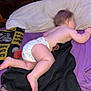 Ivy joined the competition — help win amazing prizes! baby, diaper, sleeping, bed, blanket, pillow, wooden_headboard, purple_sheet, black_blanket, indoor, infant, child, resting, cute, peaceful, soft_skin, small_toes, plaid, football_team, sports_pillow