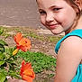 Zella joined the competition — help win amazing prizes! child, girl, smile, flower, hibiscus, orange_flower, greenery, garden, outdoor, nature, plant, summer, happy, portrait, young, cute, dress, sunlight, leaf, face