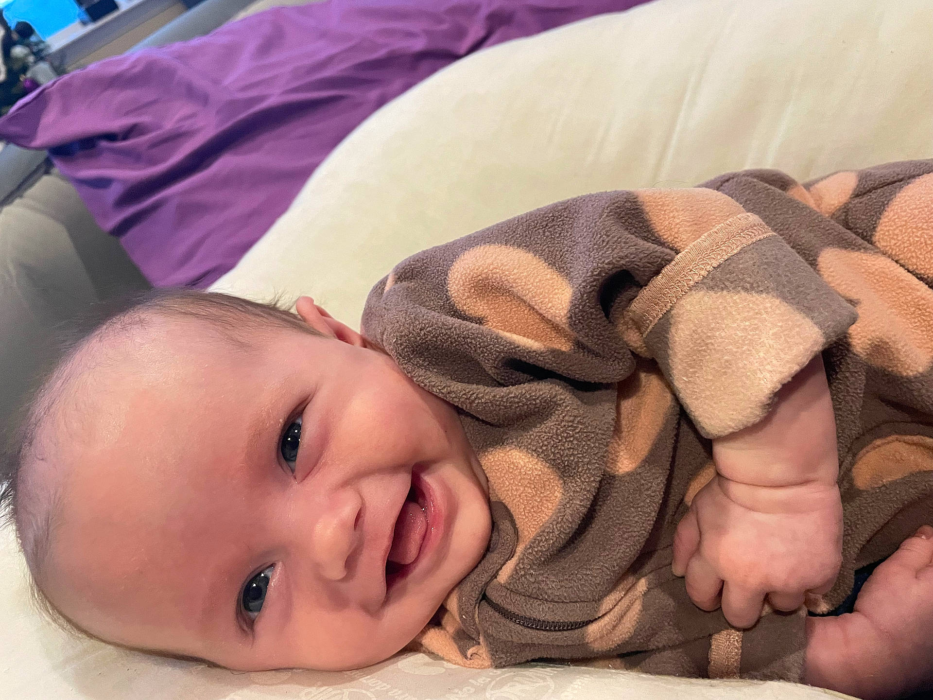 Riley is registered to the contest to win money with this photo: baby, babylaughing, blanket, bodypart, couch, cushion, face, finger, furniture, hand, happy, head, homedecor, laughing, newborn, person, photography, portrait, quilt, smile