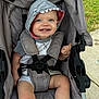 toddler, child, stroller, baby, smiling, hood, shark_costume, blue_eyes, outdoor, grass, socks, seatbelt, happy, cute, infant, casual_clothing, fabric, baby_wear, playful, person