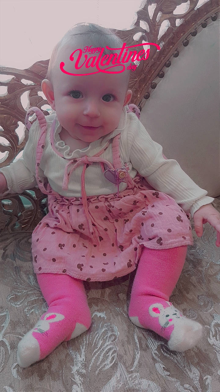 Arianna joined the competition — help win amazing prizes! baby, baby_products, baby_toddler_clothing, baby_toys, beanie, cap, cheek, child, fashion_accessory, happy, headwear, magenta, pattern, person, pink, play, purple, sitting, skin, sleeve