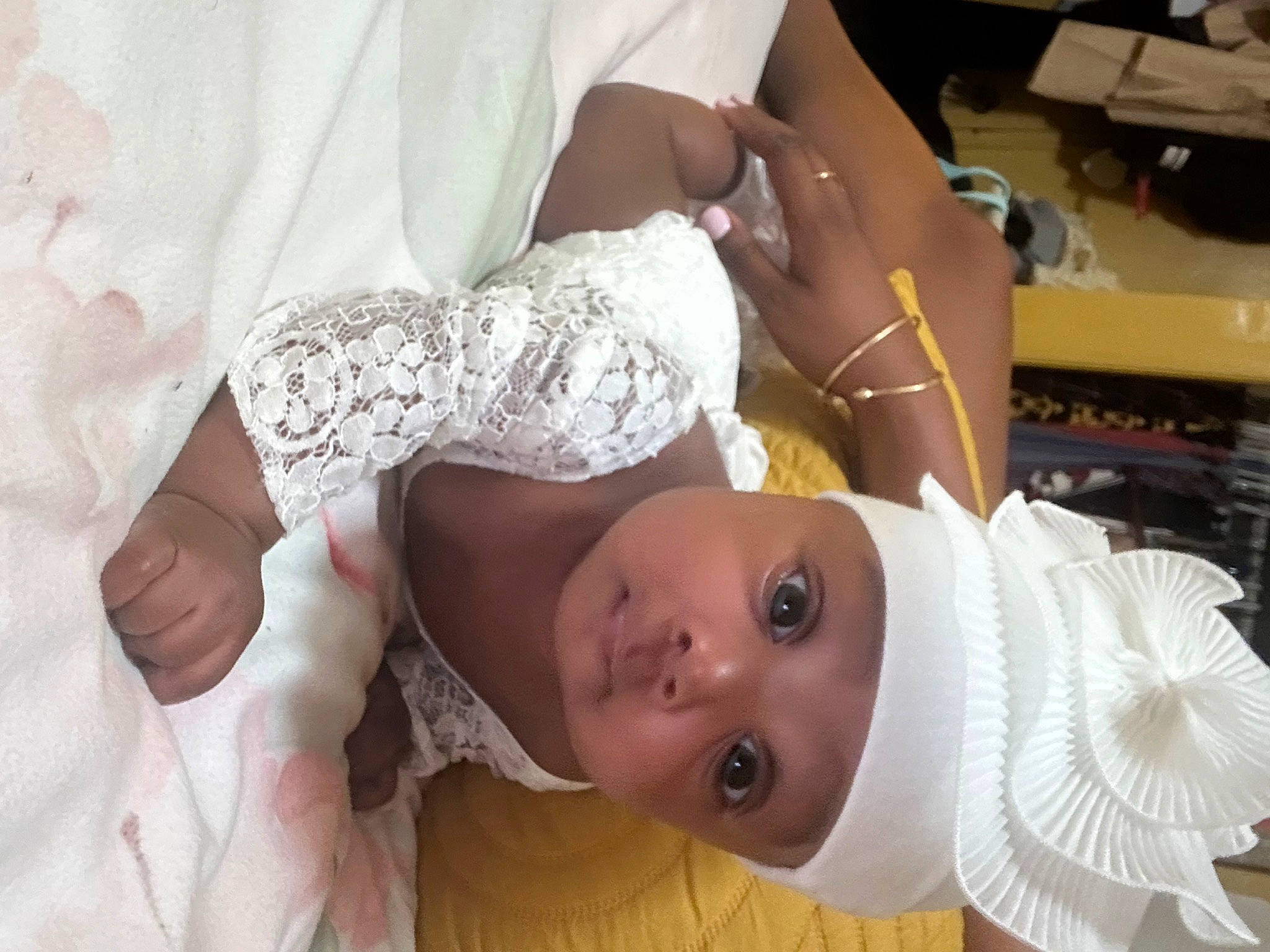 Christina joined the competition — help win amazing prizes! baby, baby_products, baby_toddler_clothing, bridal_accessory, child, dress, event, gesture, hair_accessory, happy, hat, headpiece, headwear, jewellery, pattern, person, room, skin, toddler, tradition