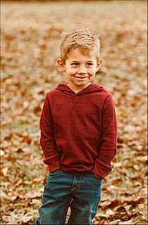 Rowan joined the competition — help win amazing prizes! blond, brown_hair, child, denim, eye, face, grass, hair, happy, jeans, joy, pattern, people_in_nature, person, plant, sitting, sleeve, smile, soil, t_shirt