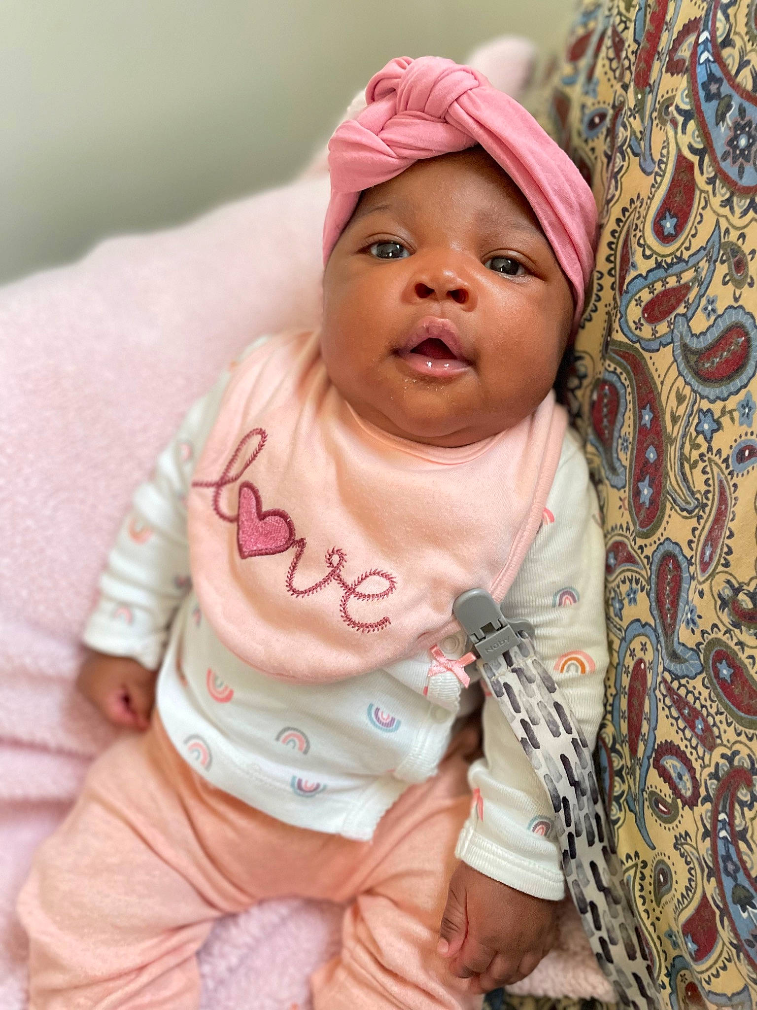 Ariel is registered to the contest to win money with this photo: baby, baby_toddler_clothing, cheek, chin, comfort, dress, eye, face, glasses, happy, head, headwear, human_body, lip, mouth, neck, outerwear, person, skin, sleeve