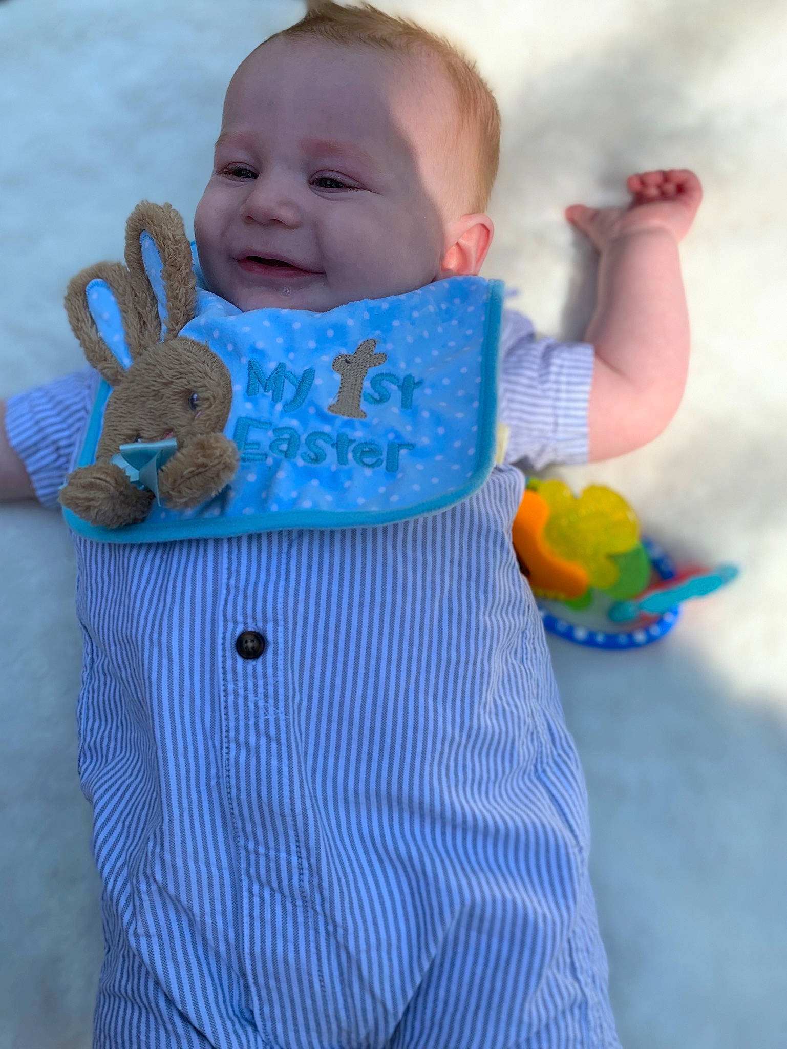 Cooper is registered to the contest to win money with this photo: aqua, azure, baby, baby_products, baby_toddler_clothing, child, electric_blue, face, finger, happy, linens, pattern, person, product, skin, sleeve, smile, t_shirt, textile, toddler