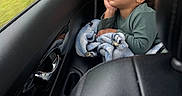 Amaro joined the competition — help win amazing prizes! blanket, car_interior, casual, child, clothing, cozy, curly_hair, daydream, hand, interior, looking_out, portrait, reflection, seat, sitting, thoughtful, toddler, travel, window, young_child