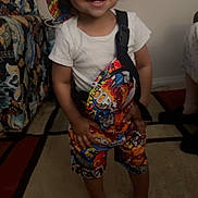Amaro joined the competition — help win amazing prizes! barefoot, bucket_hat, carpet, casual, child, colorful_clothing, couch, cute, furniture, happy, home, indoor, person, portrait, shorts, smiling, standing, toddler, white_tshirt, young_child