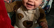 Alidar joined the competition — help win amazing prizes! baby, child, infant, smiling, happy, portrait, sitting, onesie, bear_pattern, clothing, face, eyes, mouth, indoor, blanket, floral, couch, toy, close_up, photography