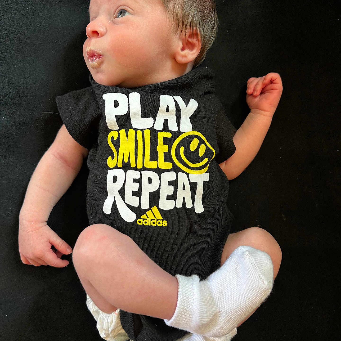 Boston is registered to the contest to win money with this photo: baby, bodypart, clothing, diaper, face, finger, footwear, hand, head, newborn, pants, person, photography, portrait, shirt, shoe, shorts, sitting, sleeve, t_shirt