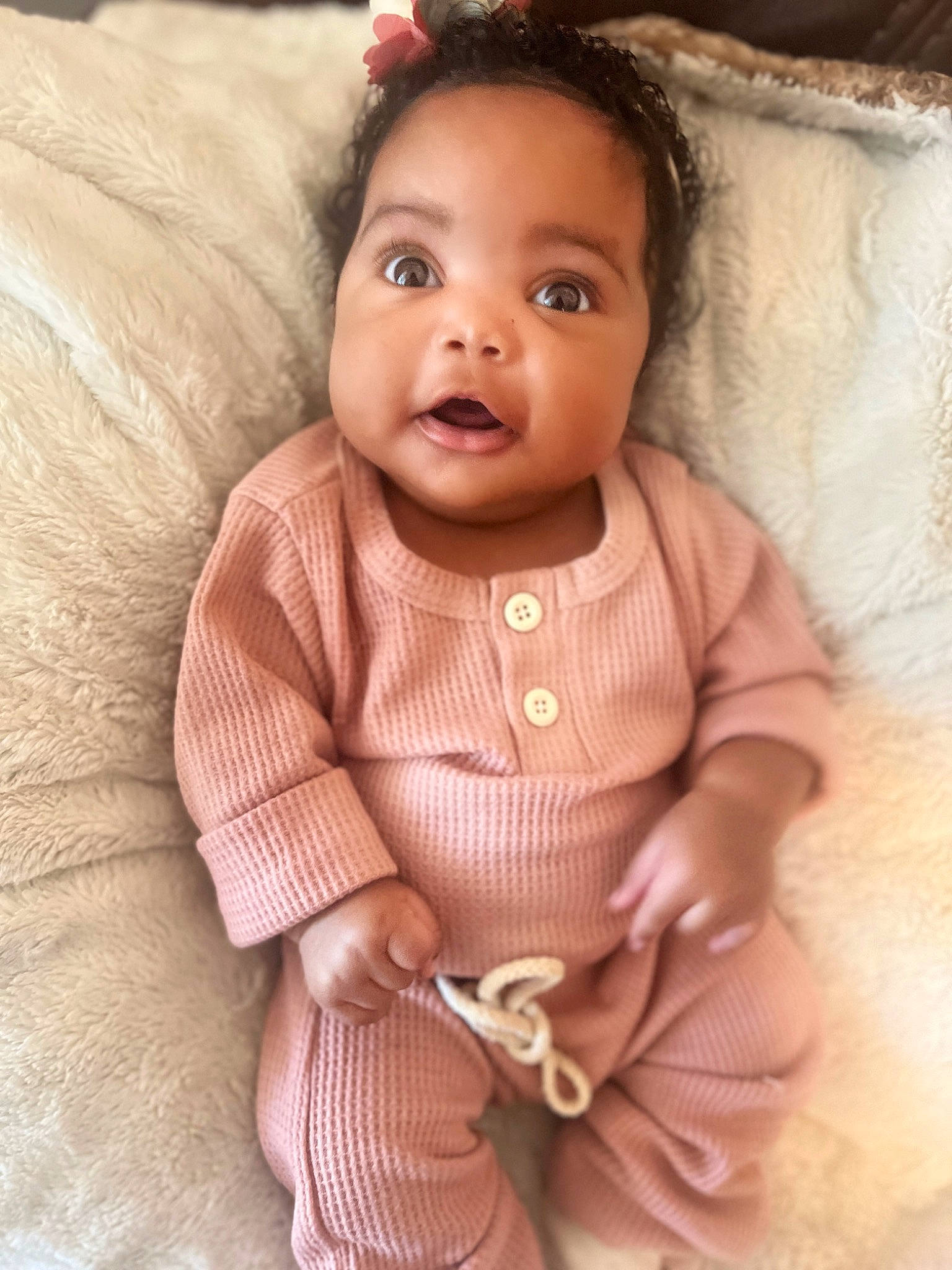 Taelyn is registered to the contest to win money with this photo: arm, baby_toddler_clothing, cheek, child, dress, eye, eyelash, face, happy, headgear, iris, lip, neck, outerwear, person, pink, skin, sleeve, smile, textile