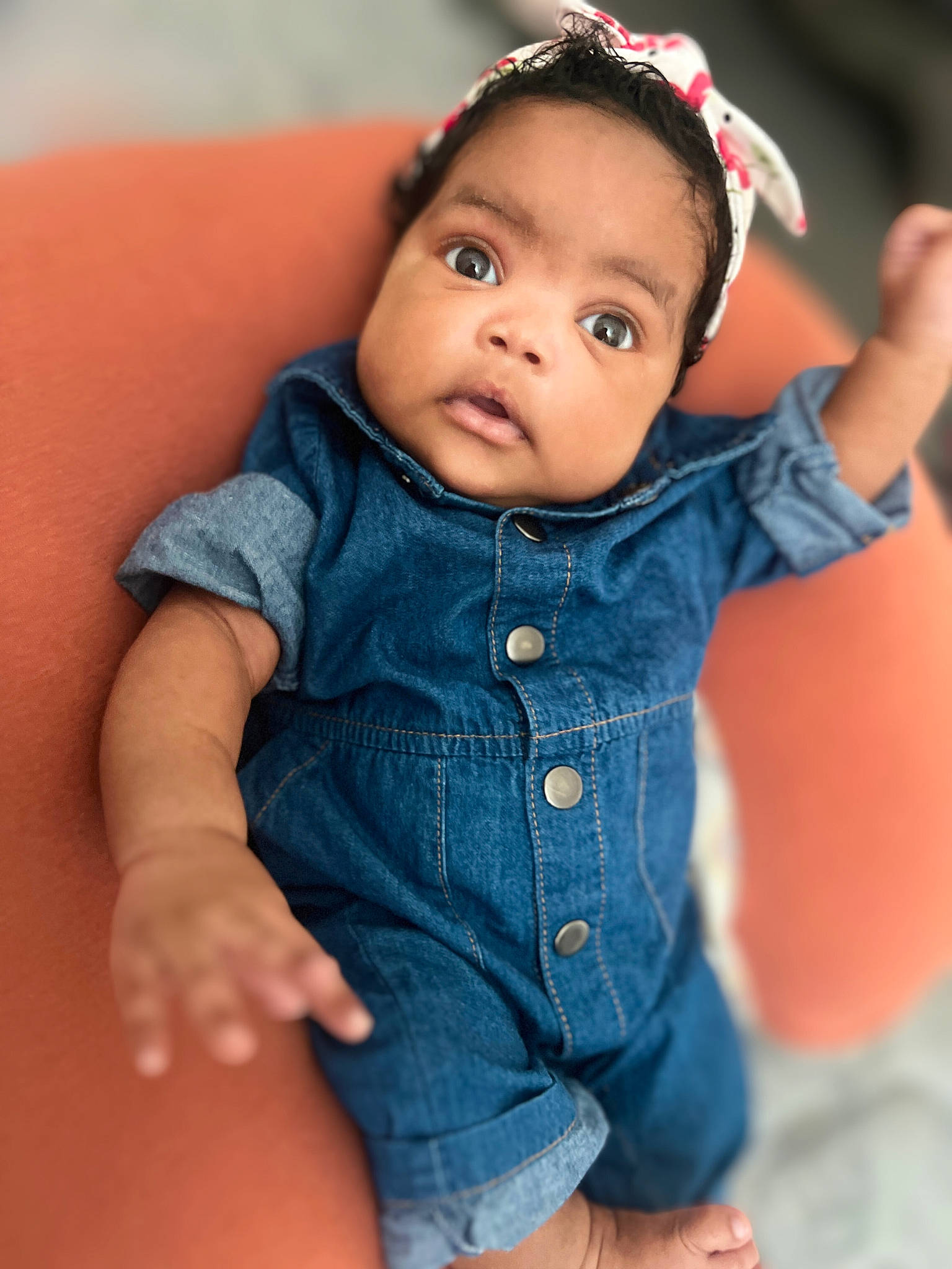 Taelyn is registered to the contest to win money with this photo: baby, baby_toddler_clothing, black_hair, cheek, child, collar, electric_blue, eye, eyelash, face, flash_photography, gesture, happy, lip, nose, person, plant, shoulder, skin, sleeve