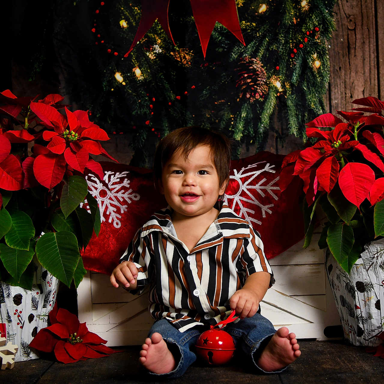 Vincent is registered to the contest to win money with this photo: barefoot, child, christmas_decor, cute, decorative_pillow, festive, gift_wrapping, greenery, holiday, indoor, jeans, poinsettia, red_flowers, red_jingle_bell, sitting, smile, snowflake, striped_shirt, toddler, wooden_floor