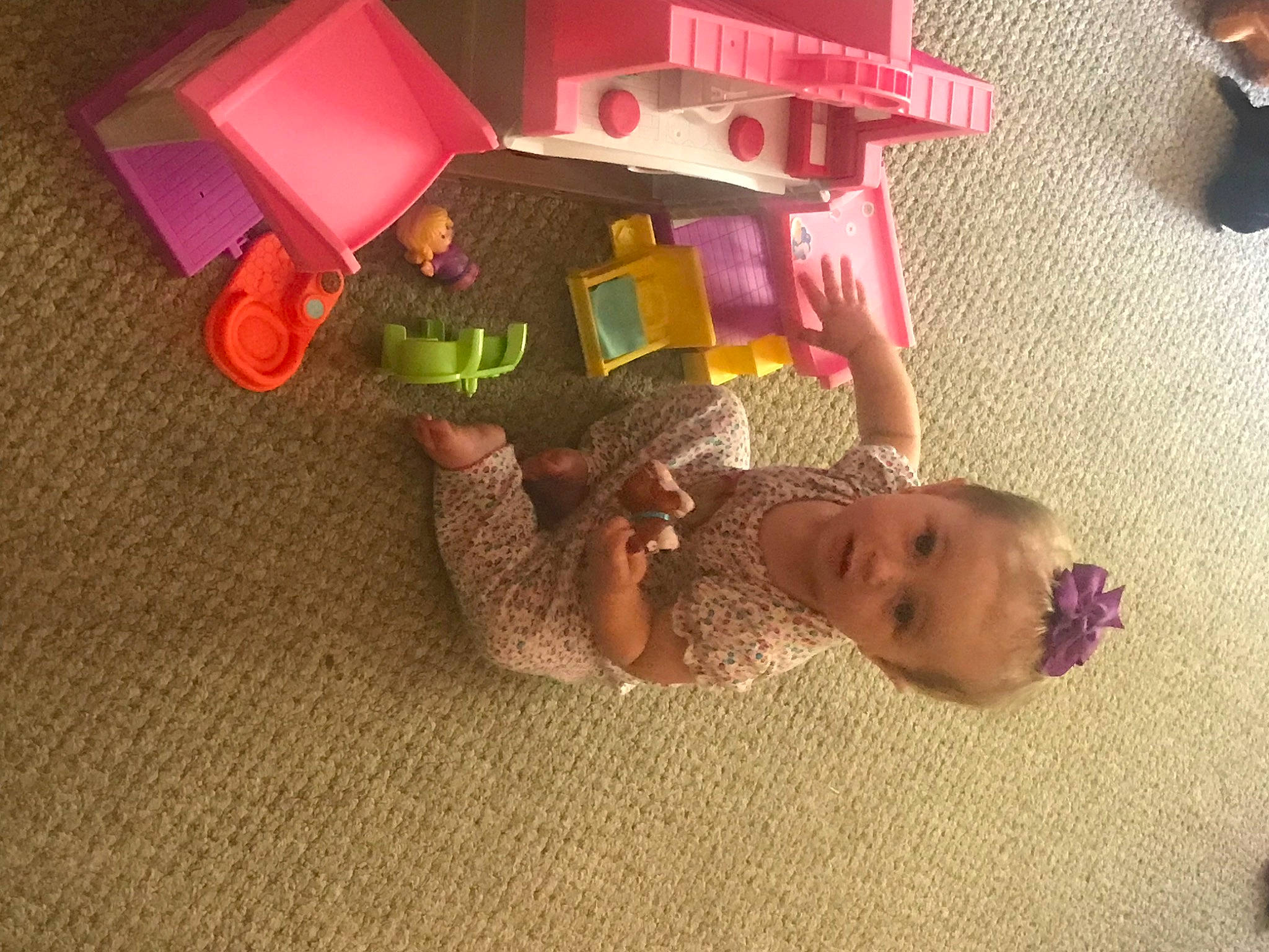 Emmalyn is registered to the contest to win money with this photo: baby, baby_products, baby_toys, cardboard, child, design, flooring, fun, hardwood, lighting_accessory, magenta, paper, paper_product, person, pink, plastic, room, toddler, toy, tree