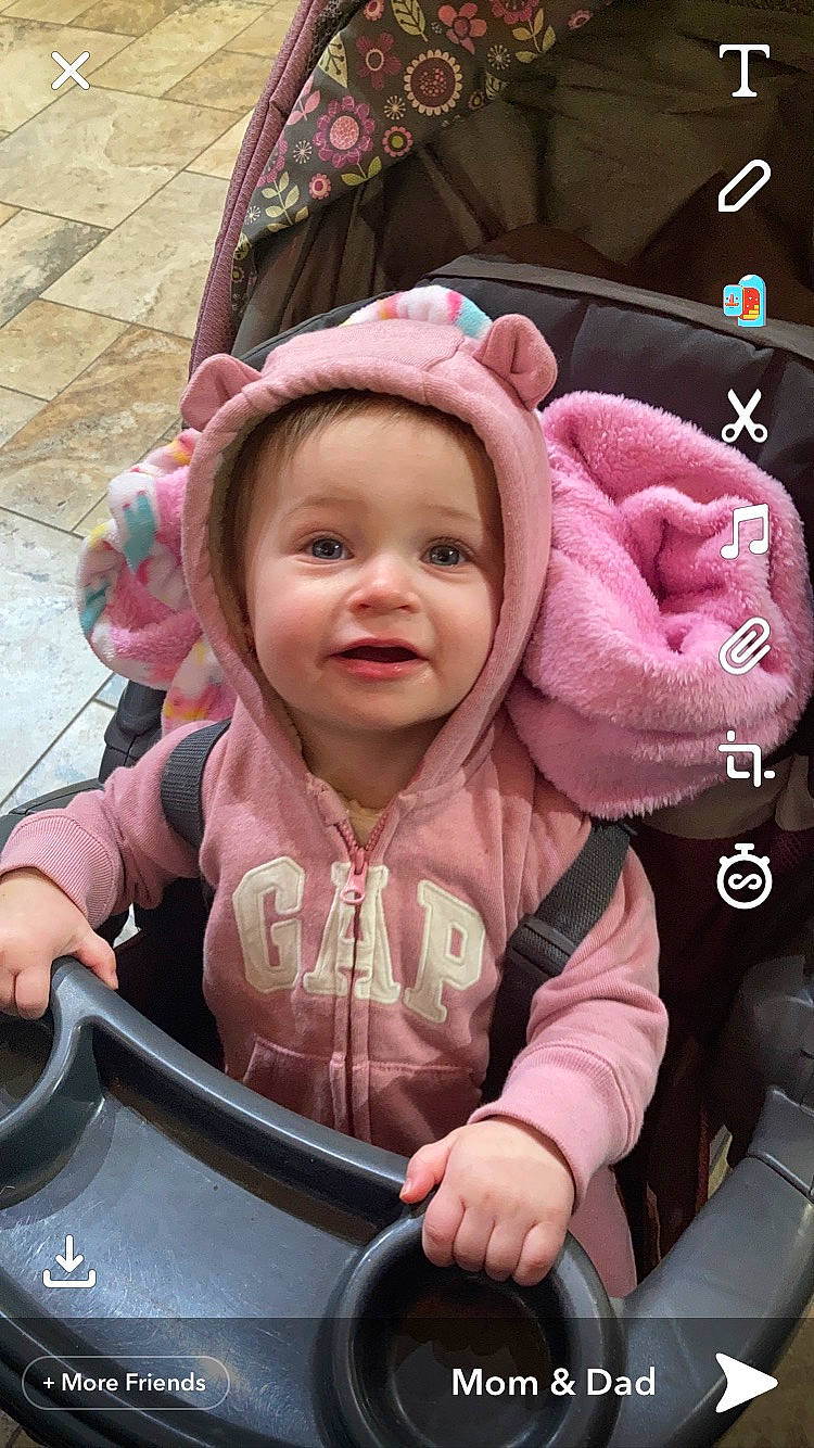 Emmalyn is registered to the contest to win money with this photo: auto_part, baby, baby_carriage, baby_products, baby_toddler_clothing, cheek, child, cool, fashion_accessory, fun, gesture, happy, headwear, leisure, mouth, person, pink, recreation, skin, smile