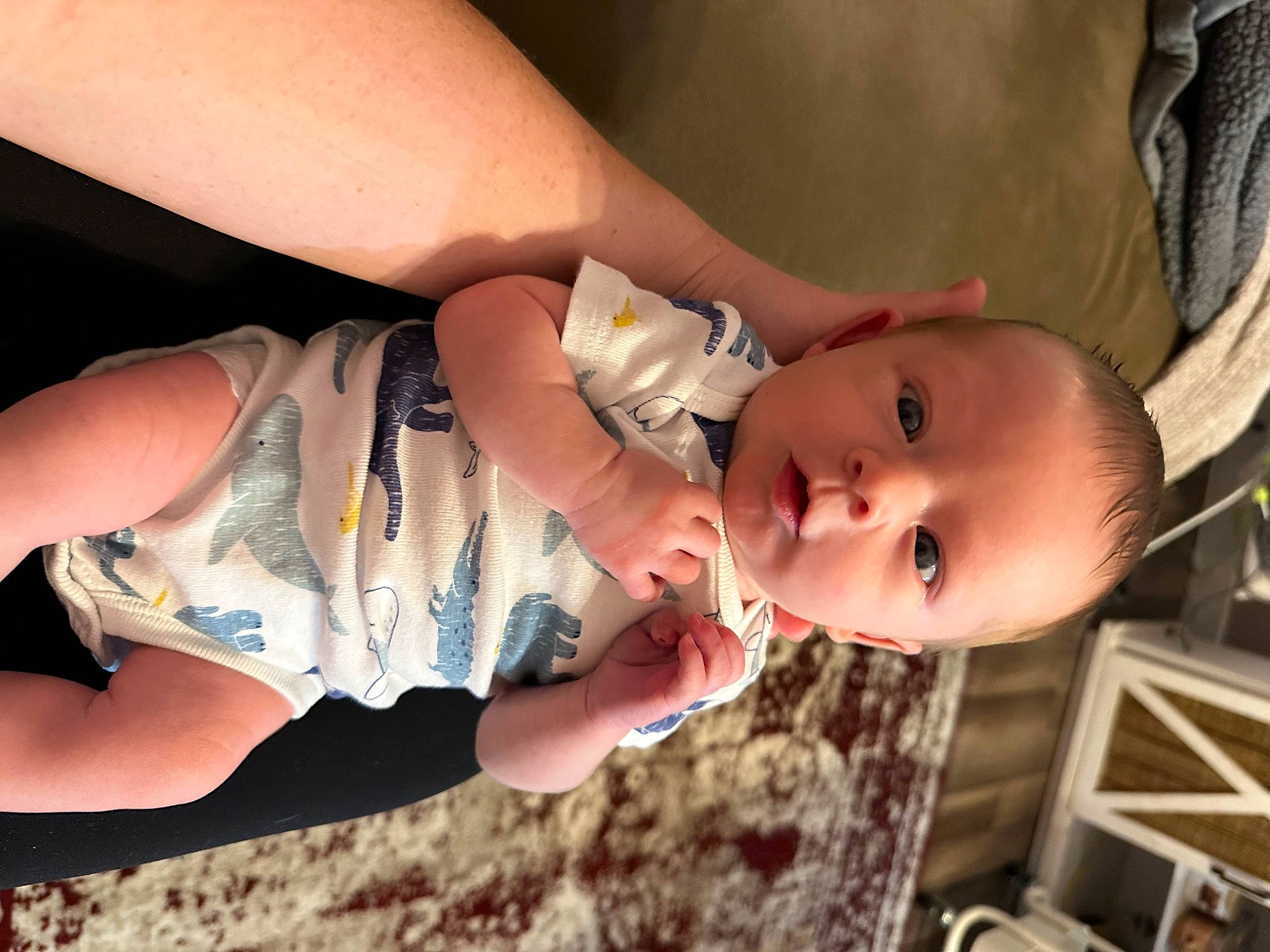 Dawson is registered to the contest to win money with this photo: arm, baby, dress, eyelash, facial_expression, flash_photography, gesture, glasses, hairstyle, hand, happy, head, human_body, joint, lip, mouth, muscle, neck, person, skin