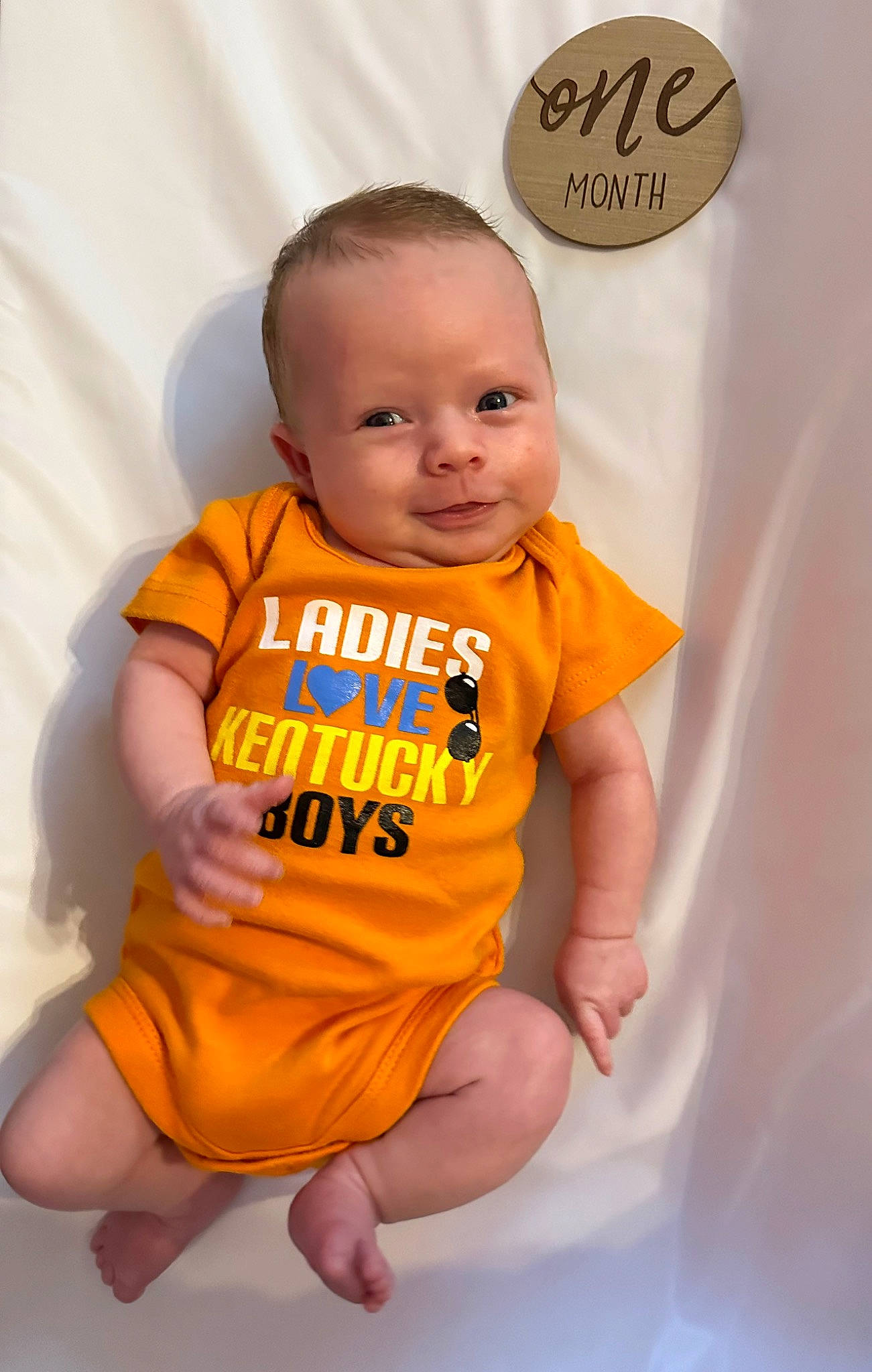 Dawson joined the competition — help win amazing prizes! baby, baby_products, baby_toddler_clothing, cheek, child, dress, finger, flooring, fun, happy, head, logo, orange, peach, person, sitting, sleeve, smile, stomach, t_shirt