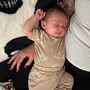 Everly joined the competition — help win amazing prizes! baby, sleeping, infant, tattoo, hand, blanket, clothing, person, adult, nails, pattern, cozy, relaxing, rest, soft, fabric, skin, portrait, comfort, lying