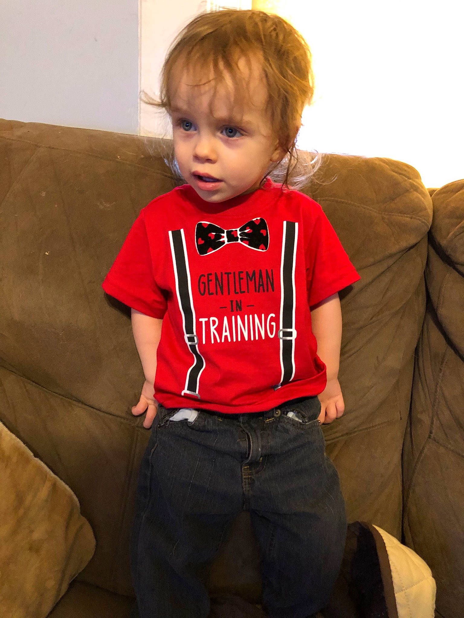 Wyatt is registered to the contest to win money with this photo: child, child_model, outerwear, person, shoulder, sitting, sleeve, standing, t_shirt, toddler