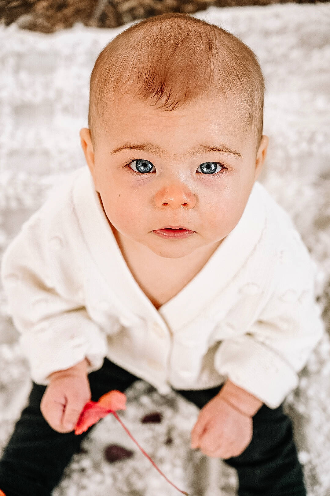 Ava is registered to the contest to win money with this photo: baby, baby_toddler_clothing, cheek, child, dress, flash_photography, flooring, fun, gesture, happy, lip, nose, pattern, people_in_nature, person, sitting, skin, sleeve, smile, toddler