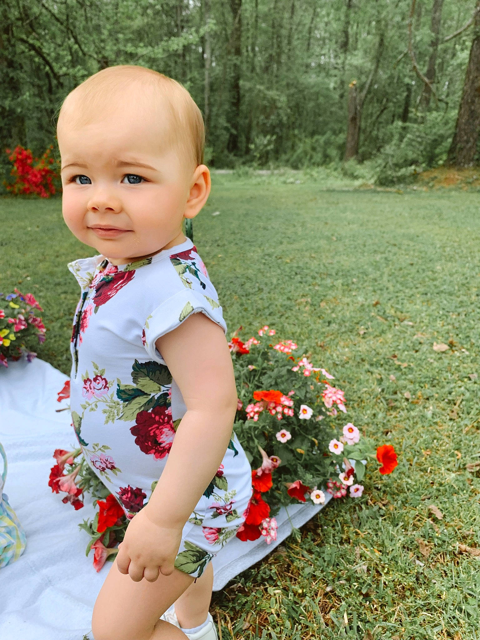 Ava joined the competition — help win amazing prizes! baby, baby_toddler_clothing, botany, dress, facial_expression, flower, grass, green, groundcover, happy, joy, people_in_nature, person, petal, plant, red, shrub, sleeve, smile, summer