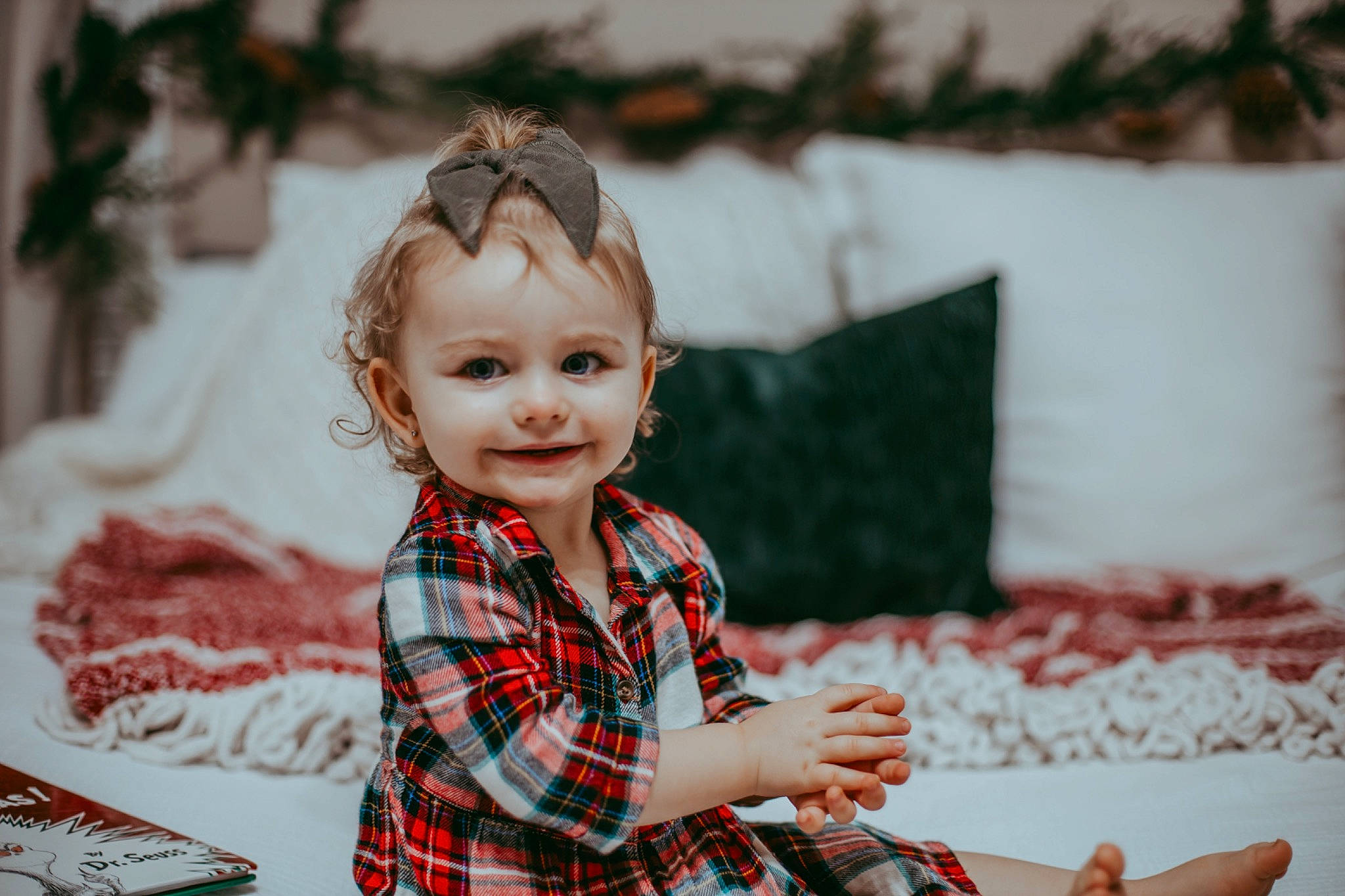 Ellie is registered to the contest to win money with this photo: baby, beauty, child, event, face, hairstyle, happy, head, joy, leisure, pattern, person, photograph, plaid, room, sleeve, smile, tartan, toddler, toy