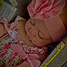 Ceceila is registered to the contest to win money with this photo: baby, infant, sleeping, portrait, close_up, pink, headband, flower, floral_outfit, frills, ribbon, car_seat, safety_straps, indoors, resting, peaceful, cute, face, child, photography