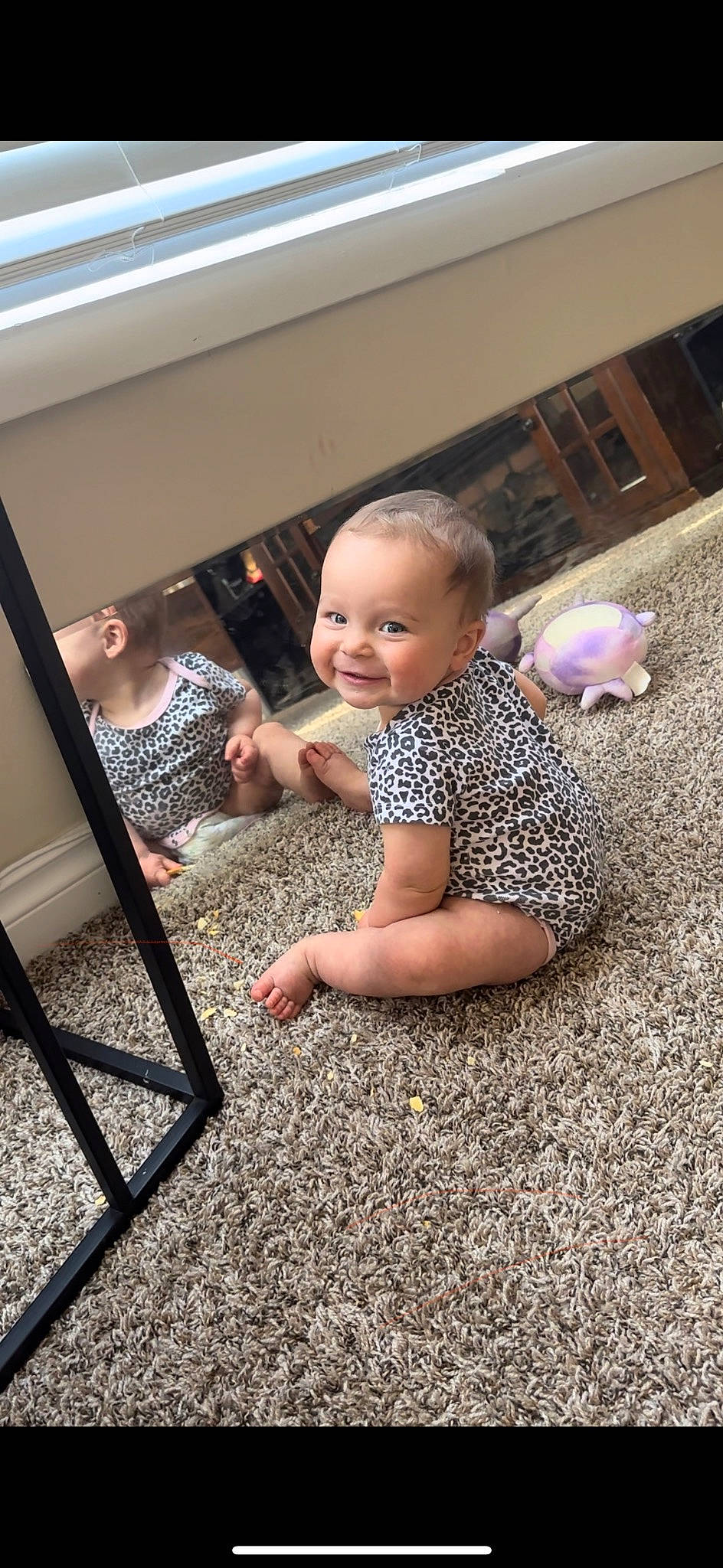 Haislie is registered to the contest to win money with this photo: asphalt, baby, baby_toddler_clothing, child, crawling, easel, floor, flooring, foot, fun, grass, human_leg, joy, leisure, person, road_surface, sitting, smile, soil, thumb