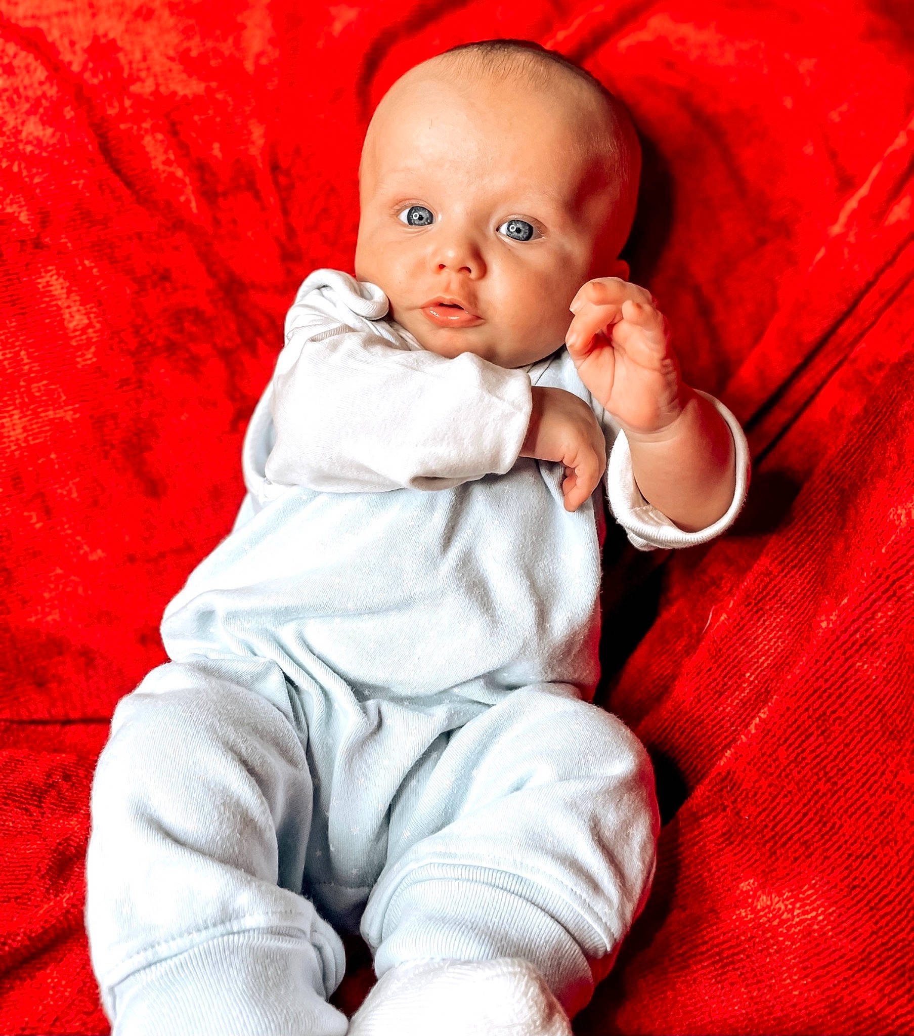 Greyson is registered to the contest to win money with this photo: art, baby, baby_sleeping, baby_toddler_clothing, cheek, child, comfort, fur, happy, linens, magenta, pattern, person, pink, portrait, portrait_photography, sitting, skin, sleeve, t_shirt